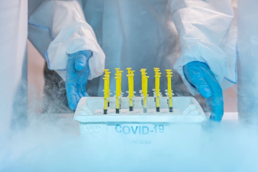 staff-distributing-covid-19-vaccine-tray-inside-the-freezer